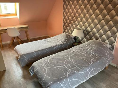 Ένα ή περισσότερα κρεβάτια σε δωμάτιο στο Grand logement 3 pièces