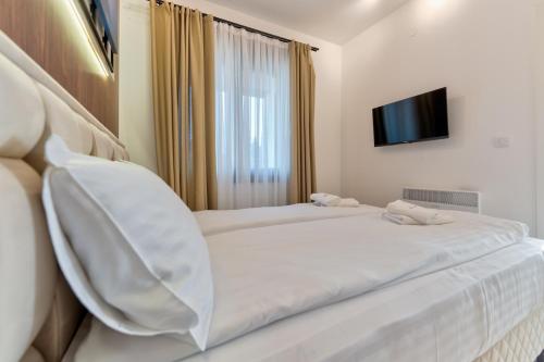 Cama o camas de una habitación en Lenika Apartments
