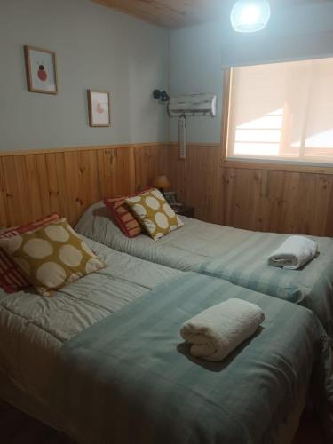 Ένα ή περισσότερα κρεβάτια σε δωμάτιο στο Cabaña Privada Pucon