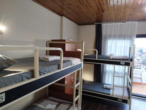 two bunk beds in a room with a window at Taksim City ivy Hostel in Istanbul
