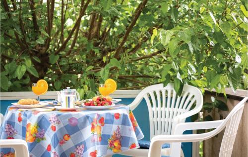 a table with a plate of food on it at Two-Bedroom Holiday Home In Slivno in Slivno