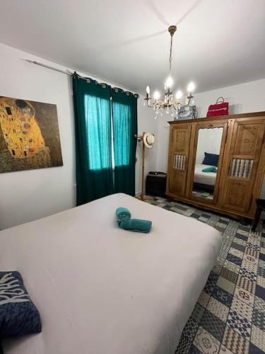 Ένα ή περισσότερα κρεβάτια σε δωμάτιο στο Villa lumineuse proche plage