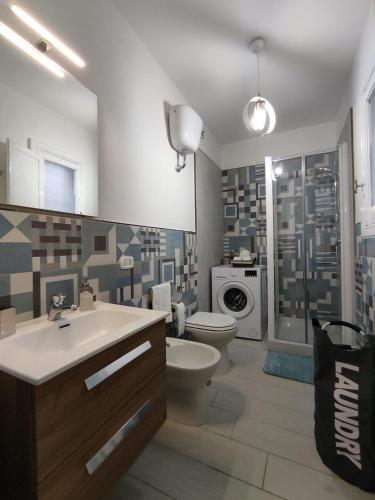 a bathroom with a sink and a toilet and a shower at Alla Chiesetta in Naples