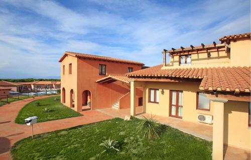 a view of a house with a yard at Vignola Baia Dei Mirti M3 in Vignola Mare