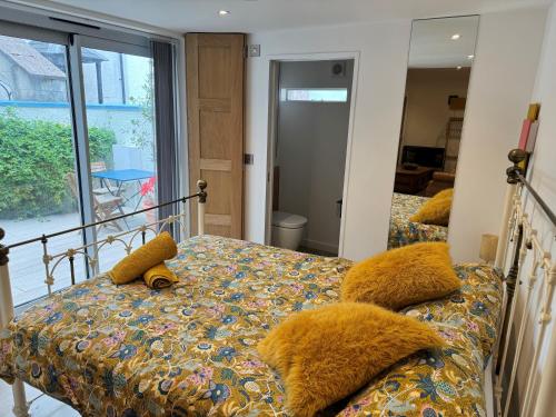 a bedroom with a bed with a teddy bear on it at Keeley House in Exeter