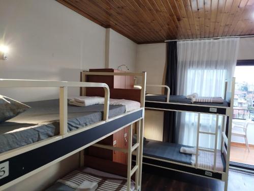 two bunk beds in a room with a window at Taksim City ivy Hostel in Istanbul
