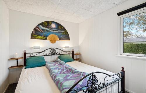 a bedroom with a bed and a window at 4 Bedroom Cozy Home In Vinderup in Vinderup