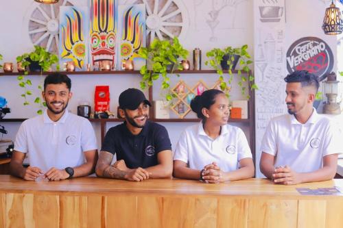 a group of people sitting at a table at le bella1912 in Galle