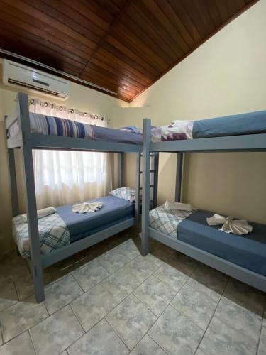 Una cama o camas en una habitación de Hotel Morada de Leste Pontal