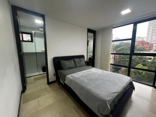 Cama o camas de una habitación en Modern Units Poblado with stunning view
