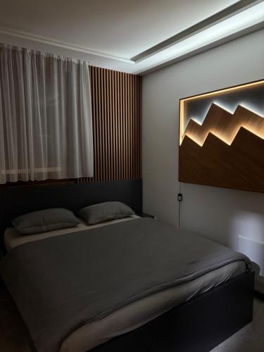 a bedroom with a large bed in a room at Duspara lux apartment Jahorina in Jahorina