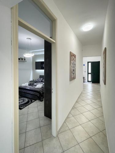 a hallway leading to a bedroom with a bed at La Casa dei Mori in Centuripe