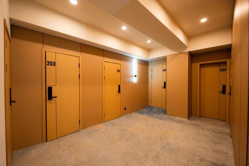 a walk in closet with yellow lockers in a room at RumHotel in Bishkek