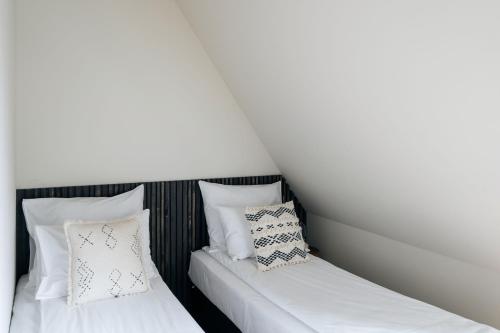 Una cama o camas en una habitación de Slow Tatry Boutique Resort&SPA