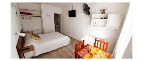 En eller flere senge i et værelse på Casa de mar