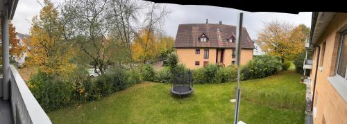 a view of a house from the outside of a window at VK - H - Zürich Airport - Luxury - Homestay - Haldenstrasse - Kloten in Kloten