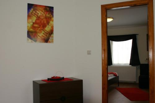a room with a mirror and a dresser and a window at Haus Alpenblick Mölltal in Flattach
