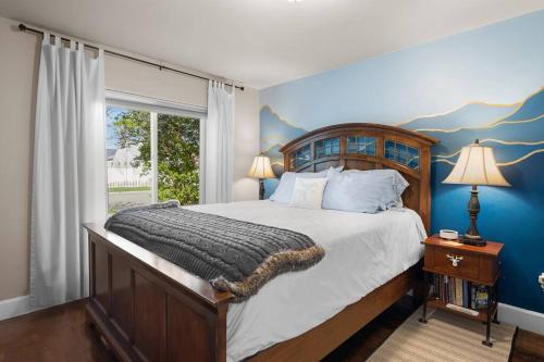 a bedroom with a large bed and a window at Charming and Cozy Private Home Walking Distance to Downtown in Kalispell