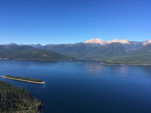an aerial view of a large lake with mountains at Charming and Cozy Private Home Walking Distance to Downtown in Kalispell