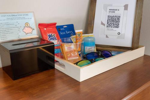 a box next to a microwave with some food at Charming and Cozy Private Home Walking Distance to Downtown in Kalispell