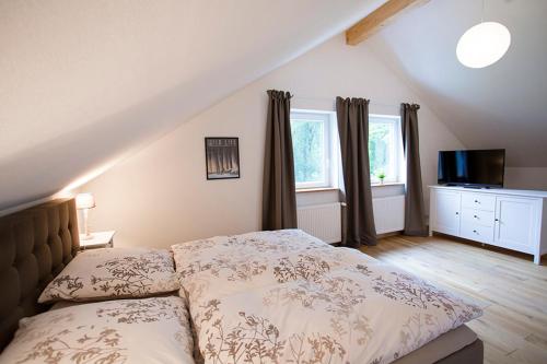 Ένα ή περισσότερα κρεβάτια σε δωμάτιο στο Ferienhaus Waldlicht