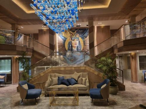 a living room with a couch and a blue balloon at Nile Cruise 3 & 4 & 7 Nights in Luxor