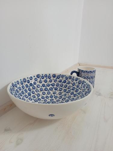 a blue and white bowl and a cup on a counter at Pano Chorio Tilos in Megálon Choríon