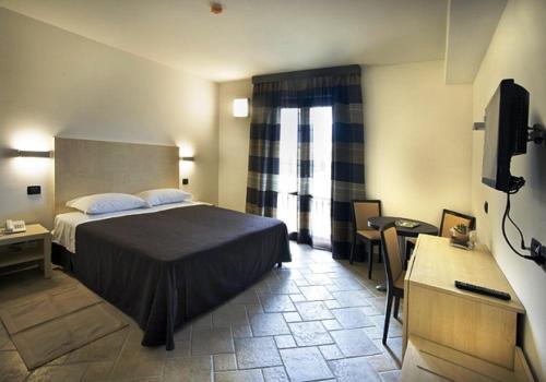 Ένα ή περισσότερα κρεβάτια σε δωμάτιο στο Villa Giovina