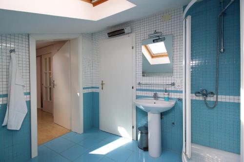 a bathroom with a sink and a shower at Apartment Klepac in Punat