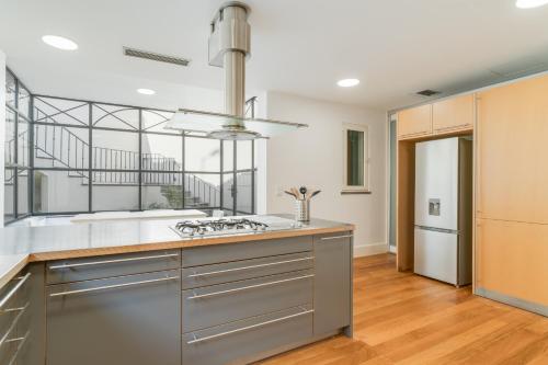 a kitchen with a sink and a stove at Sublime View Villa by Atlantic Holiday in Funchal
