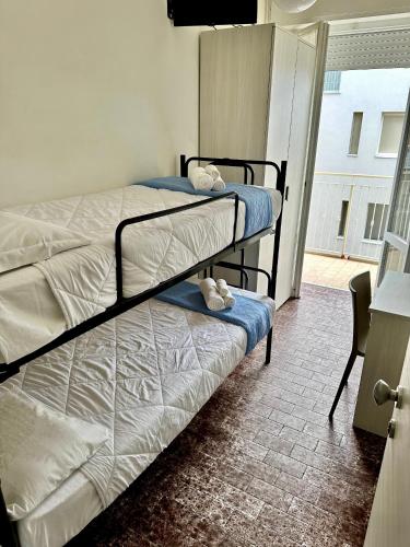 Postel nebo postele na pokoji v ubytování Hotel Napoleon