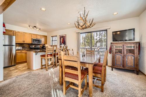 a dining room with a table and chairs and a kitchen at Breckenridge Mtn Village 132 - Beautiful Private Home just blocks from Main Street in Breckenridge