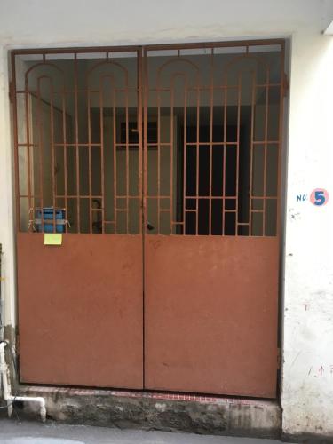 a door with a metal gate in a building at Peaceful Pondy near Aurobindo ashram & ROCK BEACH in Pondicherry