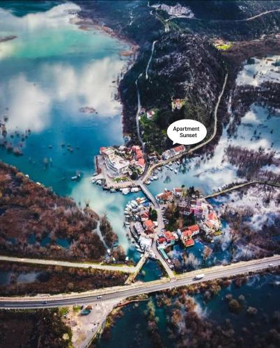 an aerial view of an island in the water at Lux Apartment Sunset in Virpazar