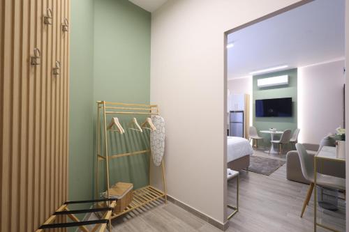 a room with a bed and a mirror at CityLuxe Center Ioannina in Ioannina