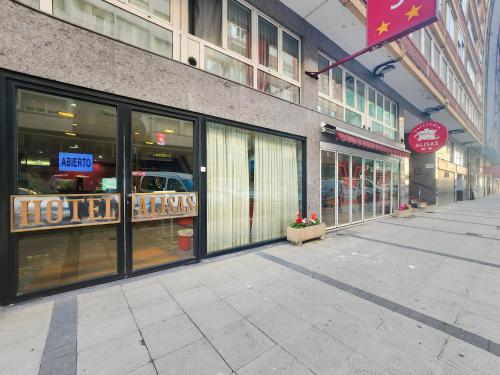 an empty street in front of a store at Hotel Faranda Alisas Santander, Ascend Hotel Collection in Santander