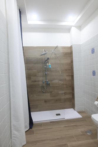 a bathroom with a shower with a shower curtain at B&B AnMa in Ercolano