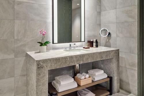 a bathroom with a sink and a mirror at The St. Regis Longboat Key Resort in Longboat Key