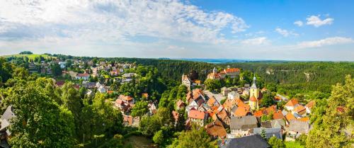 an aerial view of a town in the forest at Hotel Zur Aussicht in Hohnstein