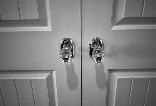 a couple of doors with diamonds on them at Kaanapali's Royal Luxury Plantation Beach & Golf Retreat in Kaanapali