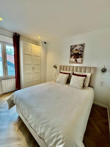 Ένα ή περισσότερα κρεβάτια σε δωμάτιο στο Appartement Cosy proche de Disney, Paris et Charles de Gaulle