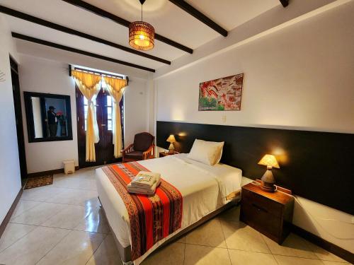 Postel nebo postele na pokoji v ubytování Chachapoyas Backpackers Hostal Boutique