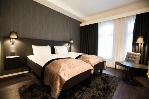 Postel nebo postele na pokoji v ubytování K7 Hotel Oslo