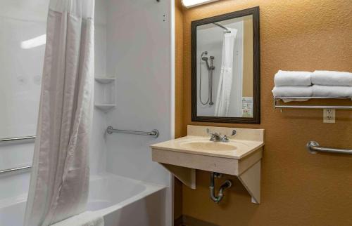 a bathroom with a sink and a tub and a shower at Extended Stay America Suites - Detroit - Ann Arbor - Briarwood Mall in Ann Arbor