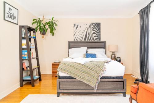 a bedroom with a bed and a book shelf at Room in cozy house close to Lawrence Ave, WiFi, parking in Toronto