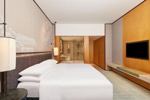Courtyard by Marriott Yangzhouにあるベッド