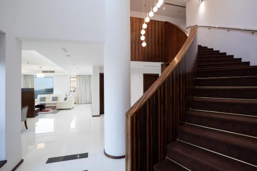 a staircase in a house with a white floor at Delta Hotels by Marriott Jumeirah Beach, Dubai in Dubai