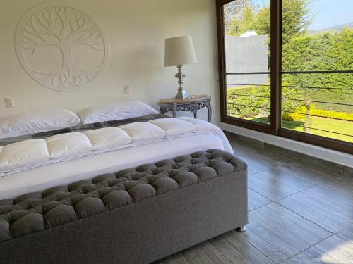 Una cama o camas en una habitación de Villa Nona