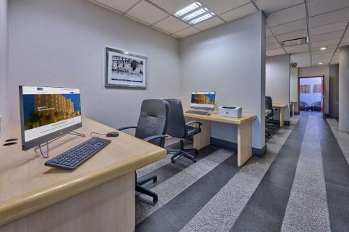 an office cubicle with a computer on a desk at City Express Plus by Marriott Ciudad de México Reforma El Ángel in Mexico City