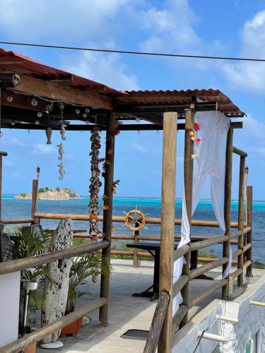 a gazebo with a view of the ocean at Sunrise view posada in Providencia
